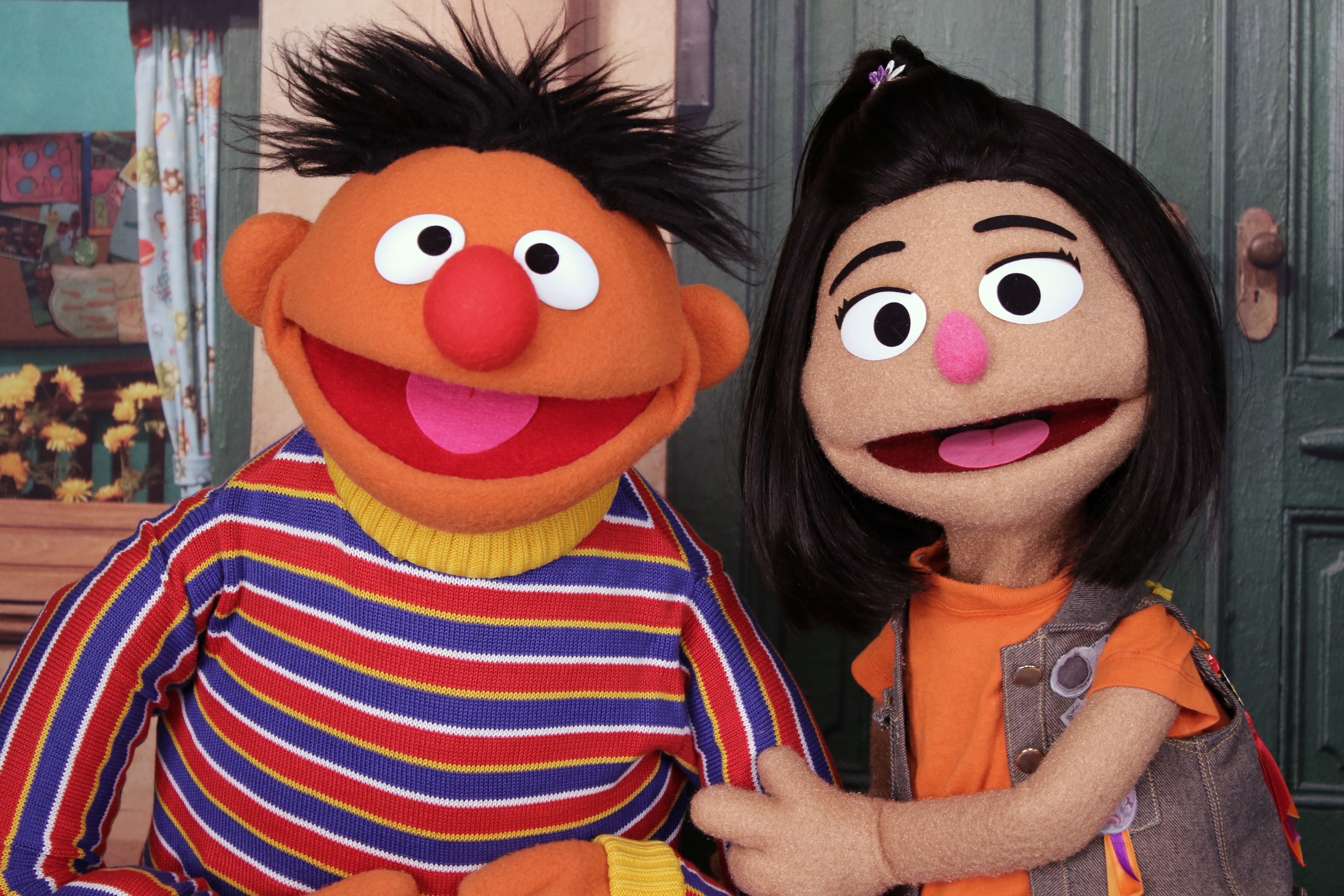 Ernie, a muppet from the popular children's series "Sesame Street," appears with new character Ji-Young, the first Asian American muppet, on the set of the long-running children's program in New York on Nov. 1. Ji-Young is Korean American and has two passions: rocking out on her electric guitar and skateboarding.