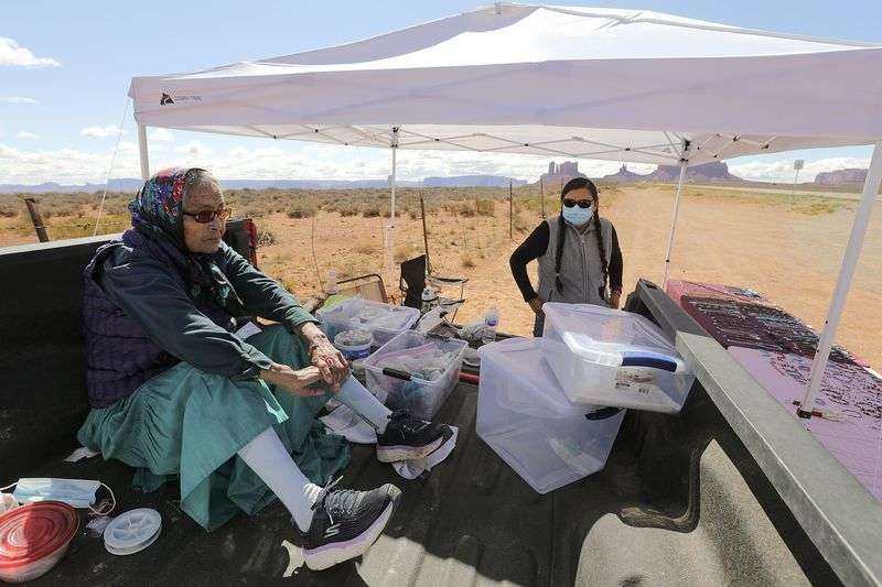 Ella Parrish, 79, takes a break from making jewelry with her daughter, Daphne Parrish, in Oljato-Monument Valley, San Juan County, on Thursday, Sept. 30, 2021