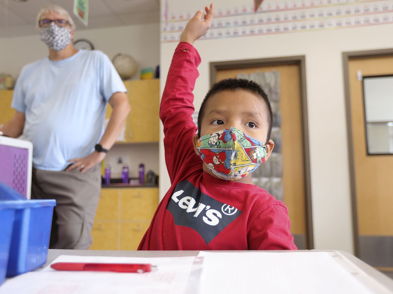 Fourth-grader Braylon Stash raises his hand during a
math class at Tse’Bii’Nidzisgai Elementary School in
Oljato-Monument Valley, San Juan County, on Sept. 30.