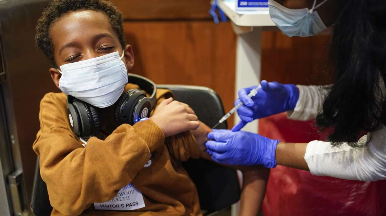 Cameron West, 9, receives a COVID-19 vaccination at Englewood Health in Englewood, N.J., Nov. 8. Health systems have released little data on the racial breakdown of youth vaccinations, and community leaders fear that Black and Latino kids are falling behind.