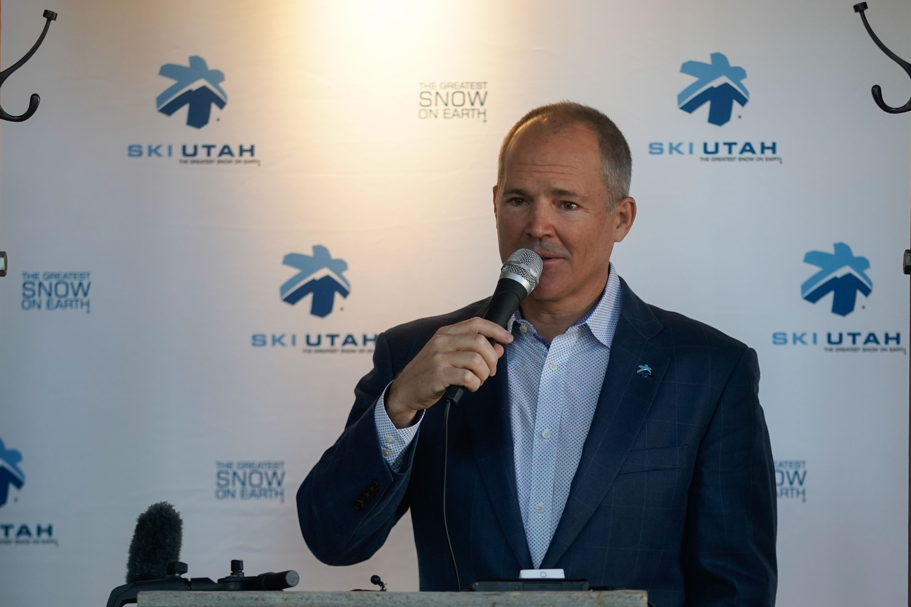 Nathan Rafferty, president and CEO of Ski Utah, highlights what's new for the 2021-22 ski season during a press conference at Squatters Pub in Salt Lake City on Monday.