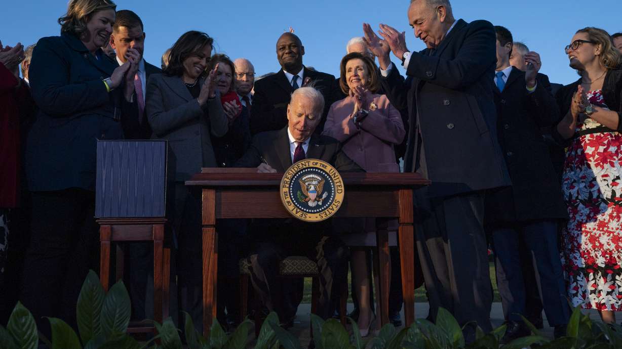 President Joe Biden signs the $1.2 trillion bipartisan infrastructure bill into law during a ceremony on the South Lawn of the White House in Washington on Monday.