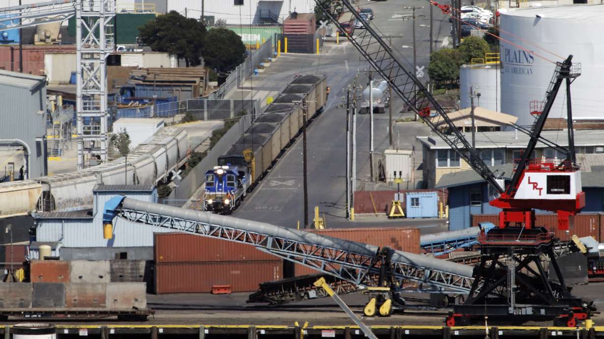 A train loaded with coal approaches the Levin-Richmond Terminal in Richmond, Calif., on July 23, 2015. The company will be required to stop handling and storing coal and petcoke products at the terminal starting on Dec. 31, 2026, under a settlement reached Nov. 12, with the city of Richmond.