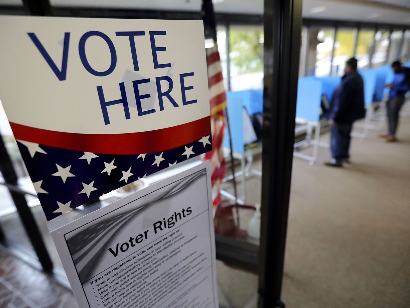 Leo Romero and Yohanes Frezgi, both of Salt Lake City,
vote at the Salt Lake County Government Center in Salt Lake City on
Election Day, Nov. 2. According to a new survey, it
appears Utah voters who participated in a ranked choice election
approved of the process and want to see the system expanded.