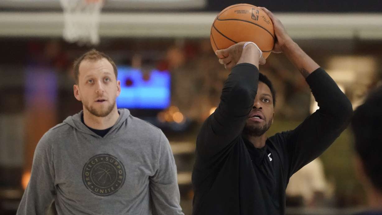 Utah Jazz's Joe Ingles, left, looks on as Rudy Gay shoots during the Utah Jazz shoot around practice on Oct. 26 in Salt Lake City. On Monday, Rudy Gay was a full participant in practice for the first time since singing with the team in August.