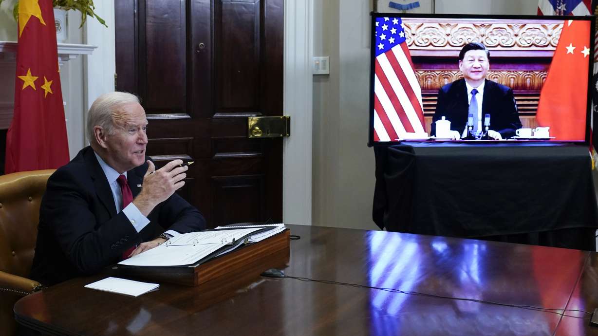 President Joe Biden meets virtually with Chinese President Xi Jinping from the Roosevelt Room of the White House in Washington, Monday, Nov. 15, 2021.