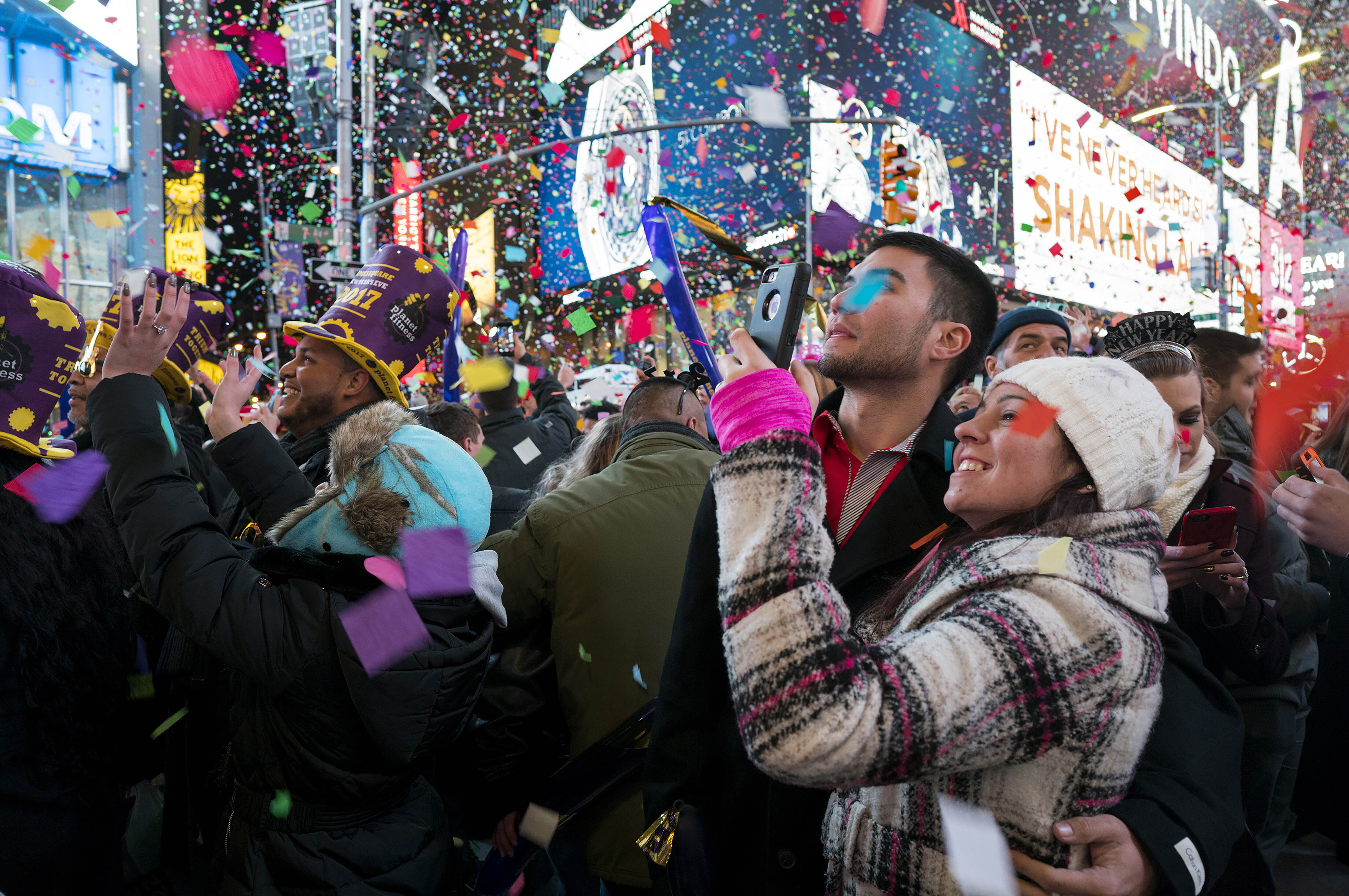 Confetti falls as people celebrate the new year in New York's Times Square, Jan. 1, 2017. Crowds will once again fill New York's Times Square this New Year's Eve, with proof of COVID-19 vaccination required for revelers who want to watch the ball drop in person, Mayor Bill de Blasio announced Tuesday. 