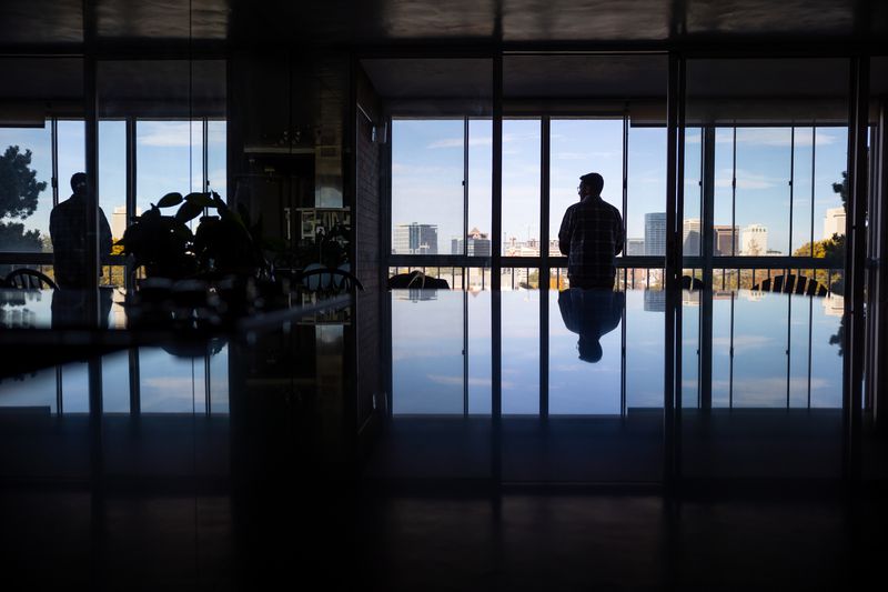 Leo Masic poses for a photo in his condo in Salt Lake
City on Oct. 22.