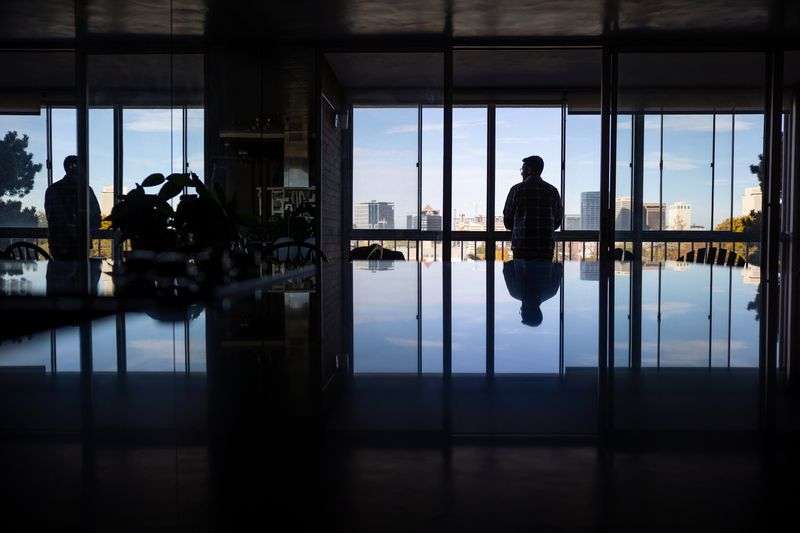 Leo Masic poses for a photo in his condo in Salt Lake
City on Oct. 22.