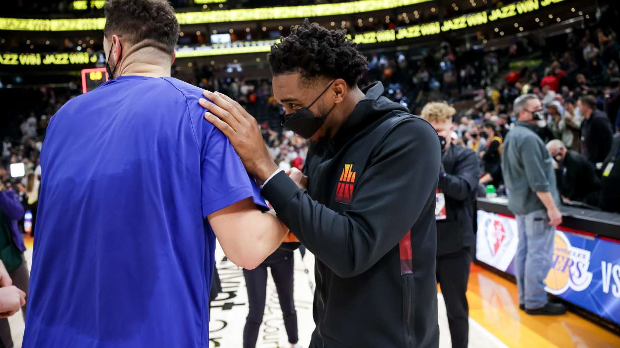 Philadelphia 76ers forward Georges Niang (20), formerly of the Jazz, and Utah Jazz guard Donovan Mitchell (45) laugh together after the game at Vivint Arena in Salt Lake City on Tuesday, Nov. 16, 2021.