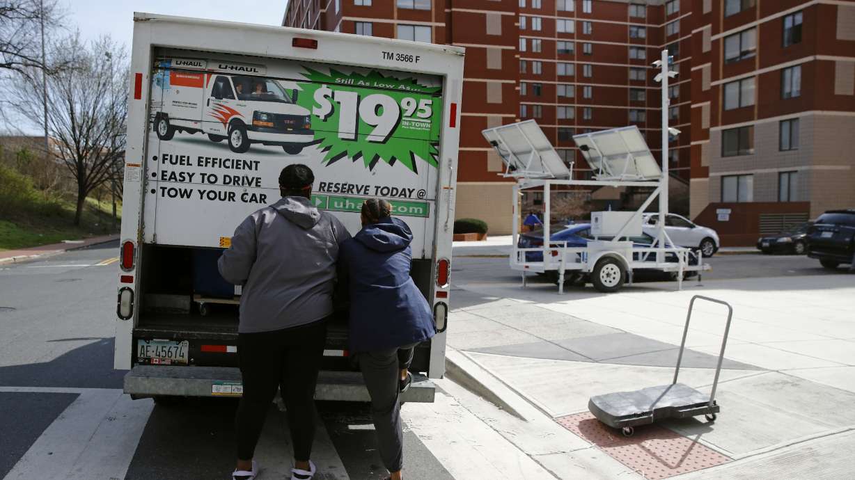 Students finish loading belongings into a U-Haul truck as they move out of their dorm in Washington on March 18, 2020. The proportion of people who moved over the past year fell to its lowest rate in the 73 years that it has been tracked, in a refutation of popular anecdotes that there was a great migration in the U.S. during the pandemic, according to figures released Wednesday by the U.S. Census Bureau.