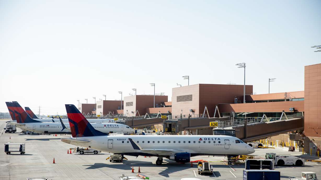 Delta jets are parked along Concourse A at Salt Lake City International Airport on Sept. 24, 2020. A construction worker died Wednesday during an industrial accident at the airport.