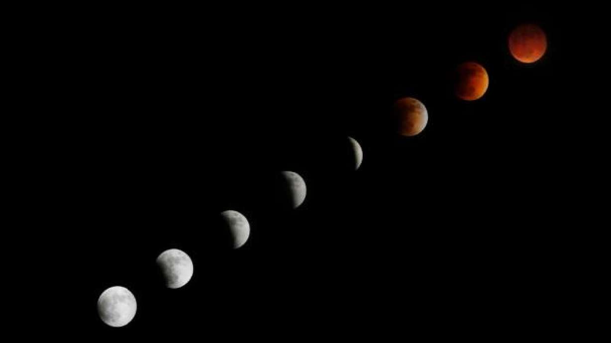 Composite of eight photos of a lunar eclipse of “super blue blood moon” as seen from above Snow Canyon State Park in Washington County on Jan. 31, 2018.