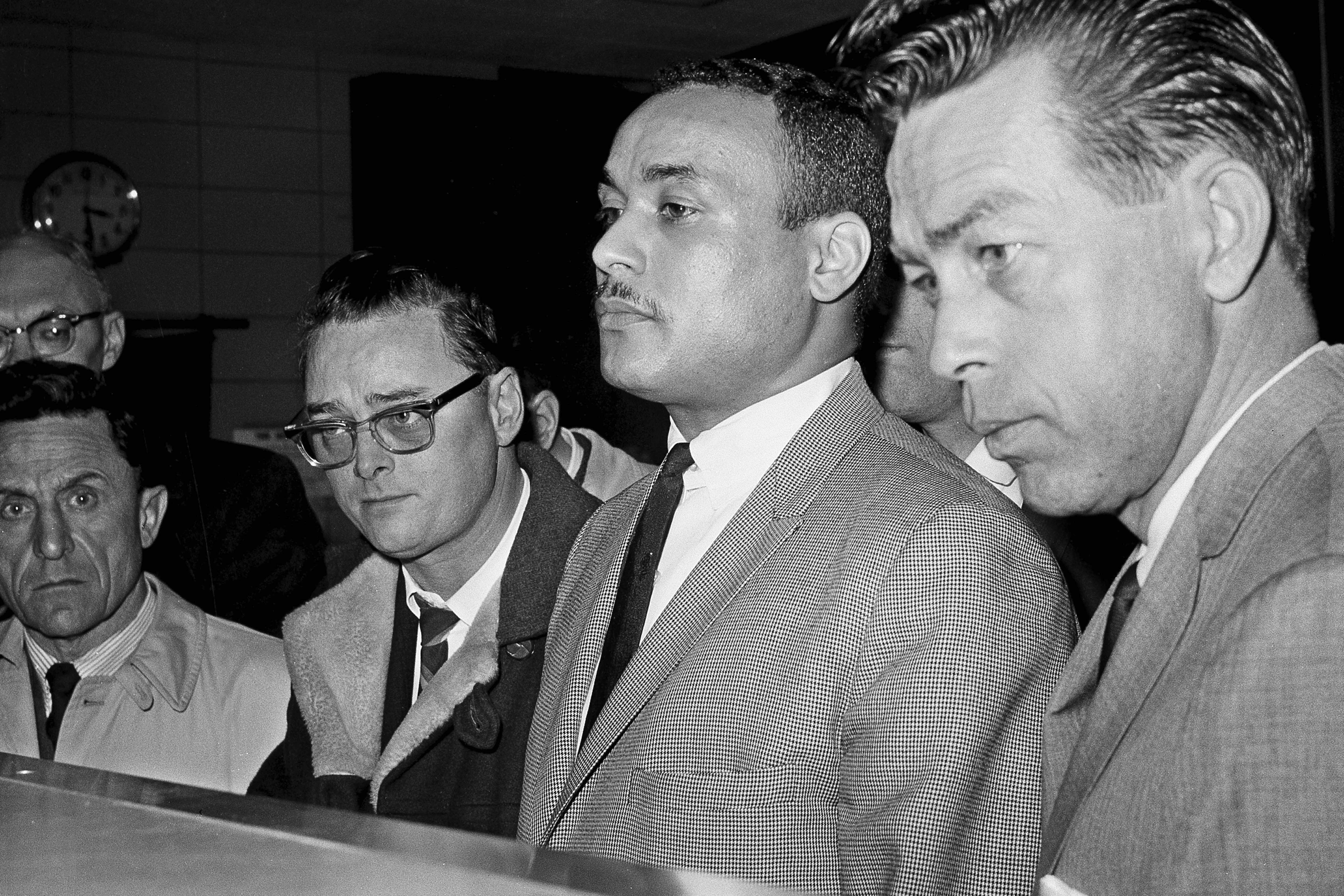 Khalil Islam, center, one of three accused of the murder of activist Malcolm X, on March 3, 1965, in New York. Manhattan judge Ellen Biben dismissed the convictions of Muhammad Aziz and the late Khalil Islam on Thursday.