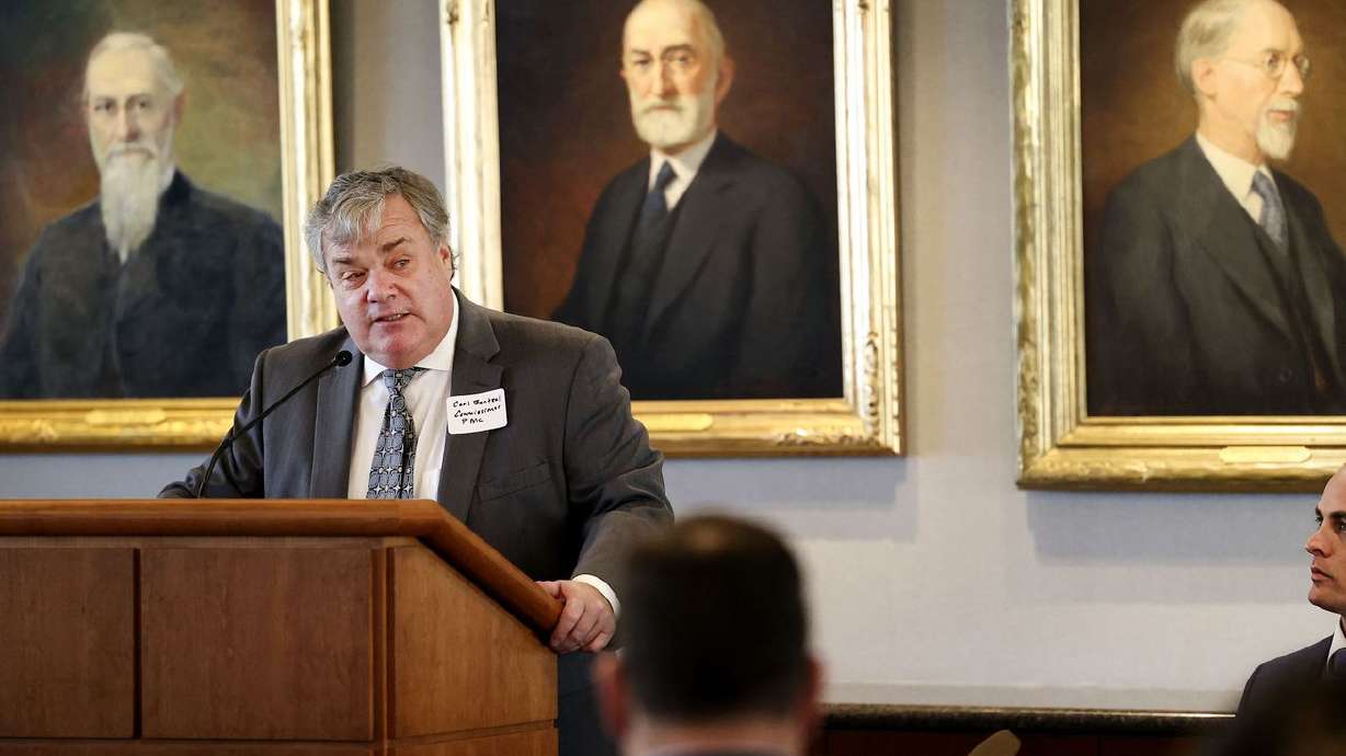 Federal Maritime Commissioner Carl Bentzel speaks at the Zions Bank Building in Salt Lake City on Wednesday. Seated at right is Miles Hansen, president and CEO of World Trade Center Utah.