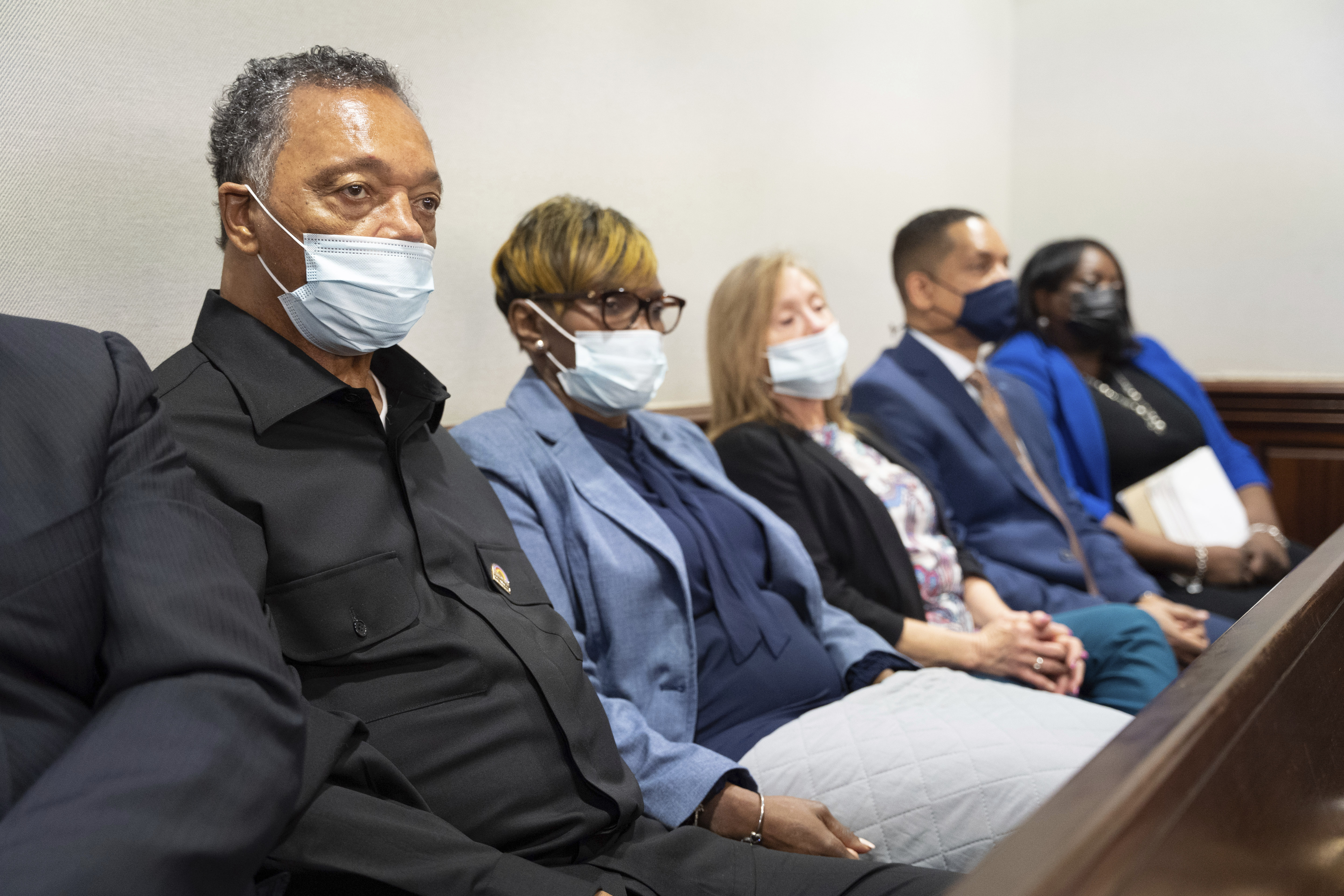 Rev. Jesse Jackson, left, sits with Wanda Cooper-Jones, mother of Ahmaud Arbery, during the trial of Arbery at the Glynn County Courthouse on Thursday, in Brunswick, Ga.