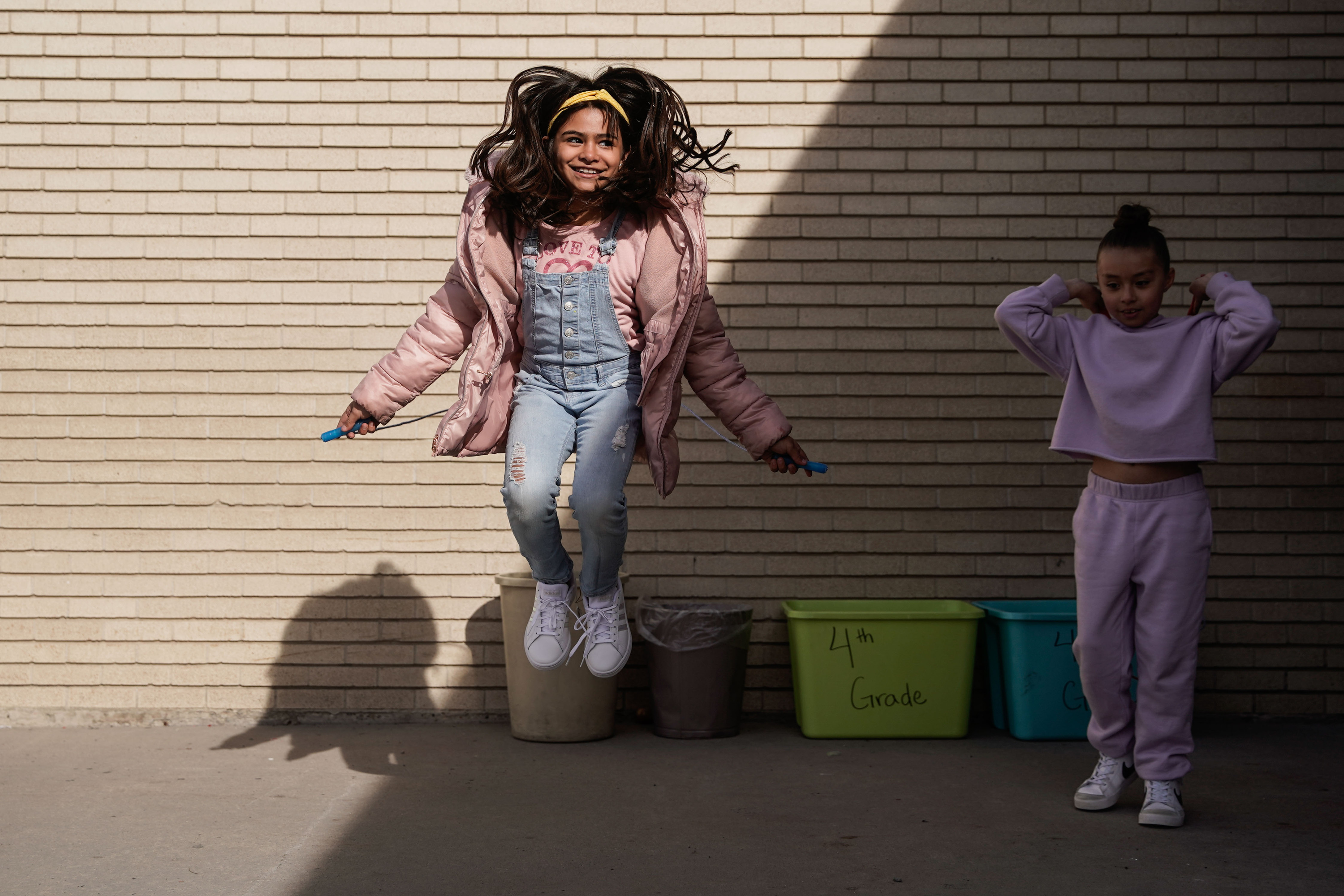 Fourth grade students at Pioneer Elementary School participate in rope jumping after receiving a new pair of shoes Thursday in West Valley City.