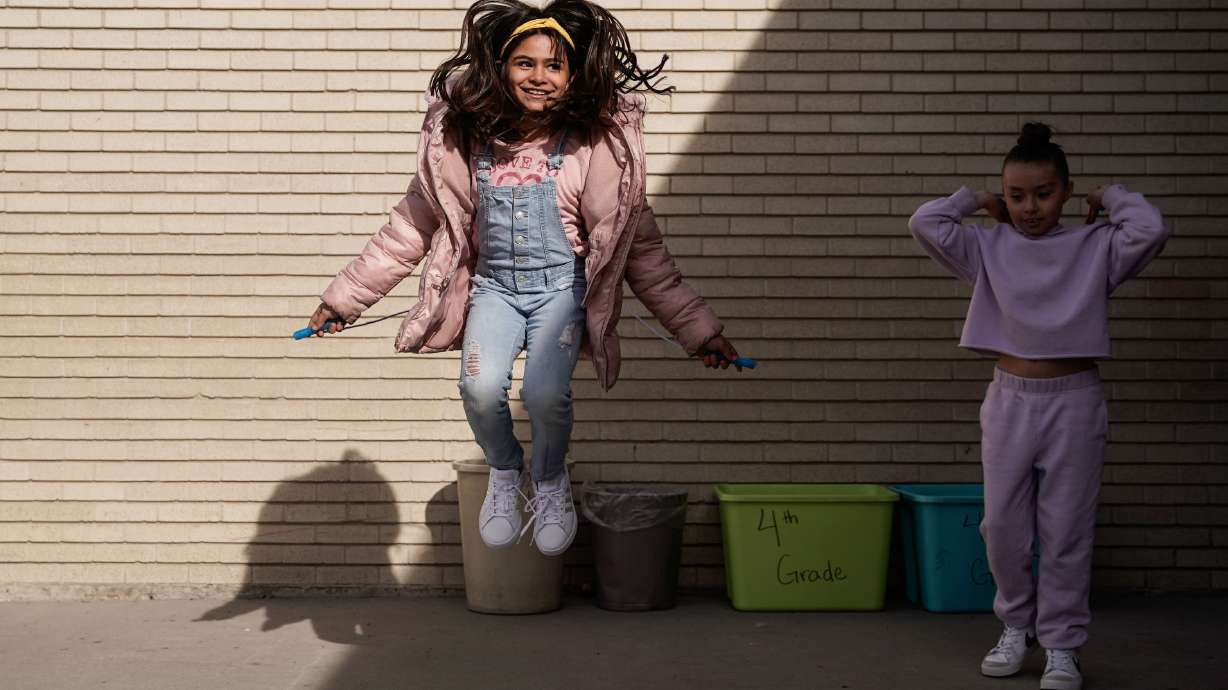 Fourth grade students at Pioneer Elementary School participate in rope jumping after receiving a new pair of shoes Thursday in West Valley City.
