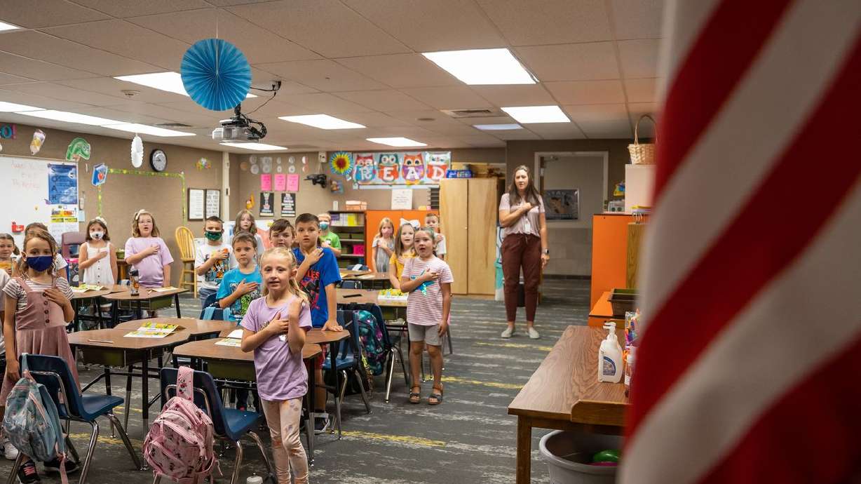 Students in Wendy Westwood’s second grade class recite
the Pledge of Allegiance on the first day of school at Altara
Elementary in Sandy on Aug. 16. The pandemic created
an "academic headwind,” a Utah school official told lawmakers this
week.