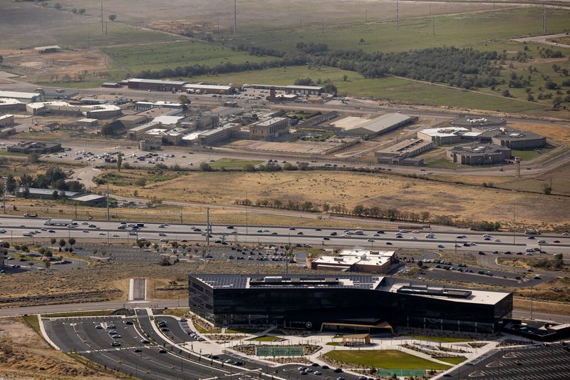 The Utah State Prison, top, and headquarters of tech
company Pluralsight, bottom right, in Draper are pictured on Aug.
25. Once the prison relocates to its new site near the
airport, the land will be redeveloped into The Point — a master
planned "complete community.”