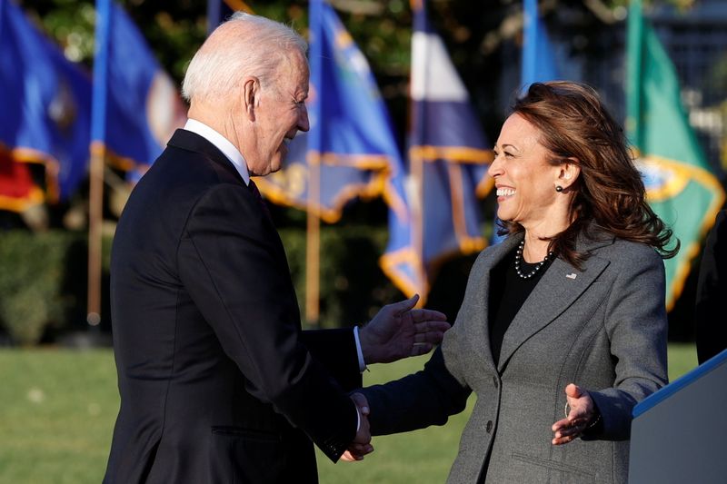 U.S. President Joe Biden and Vice-President Kamala Harris shake hands during a ceremony to sign the "Infrastructure Investment and Jobs Act," on the South Lawn at the White House in Washington, on Monday.