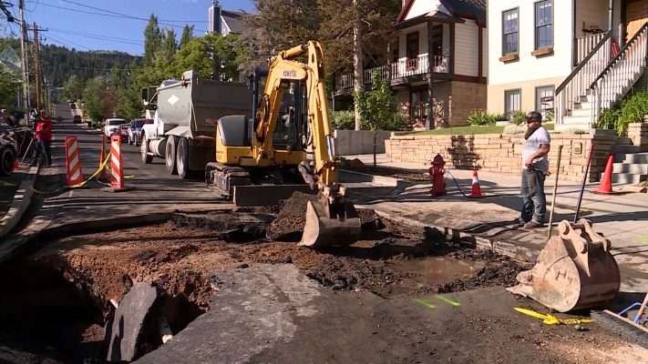 Public works crews worked to repair a massive sinkhole that opened next to Mark Stemler’s home in July 2019.