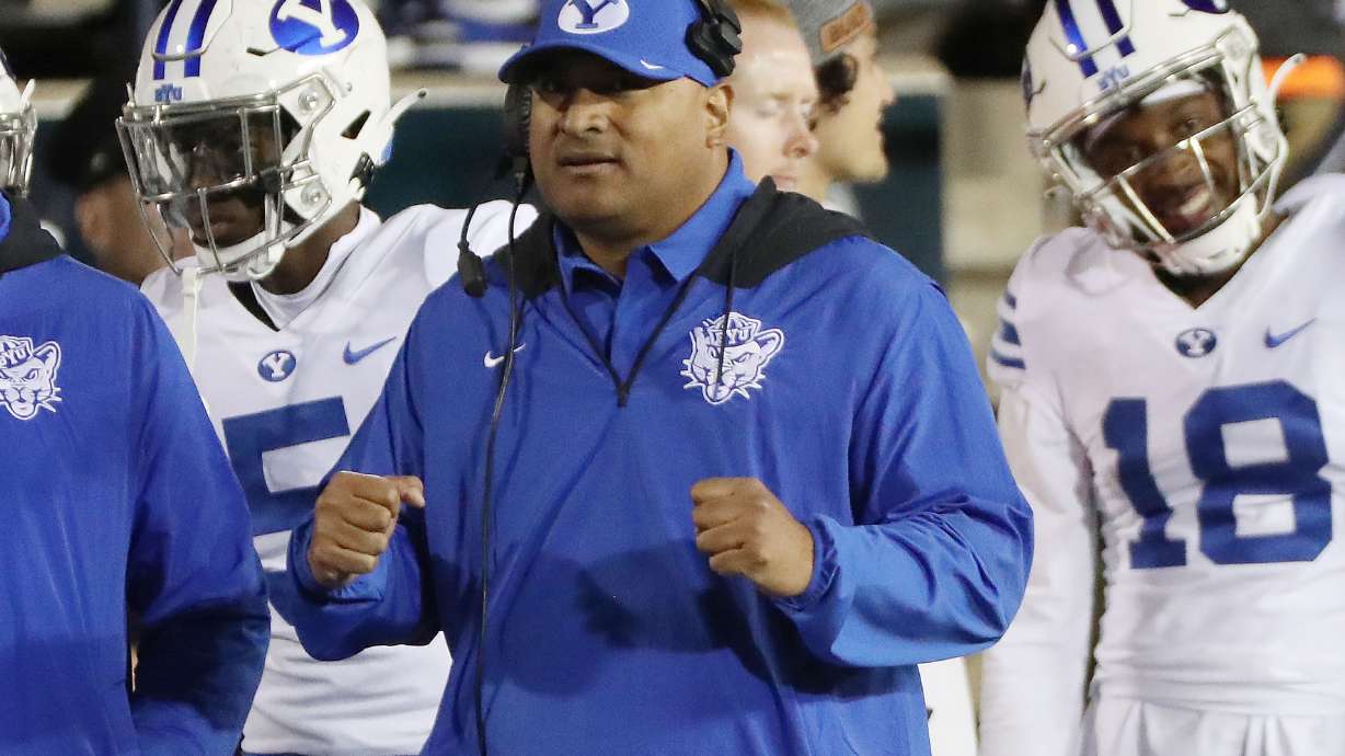 Brigham Young Cougars coach Kalani Sitake celebrates a field goal in a game against the Utah State Aggies in Logan on Friday, Oct. 1.