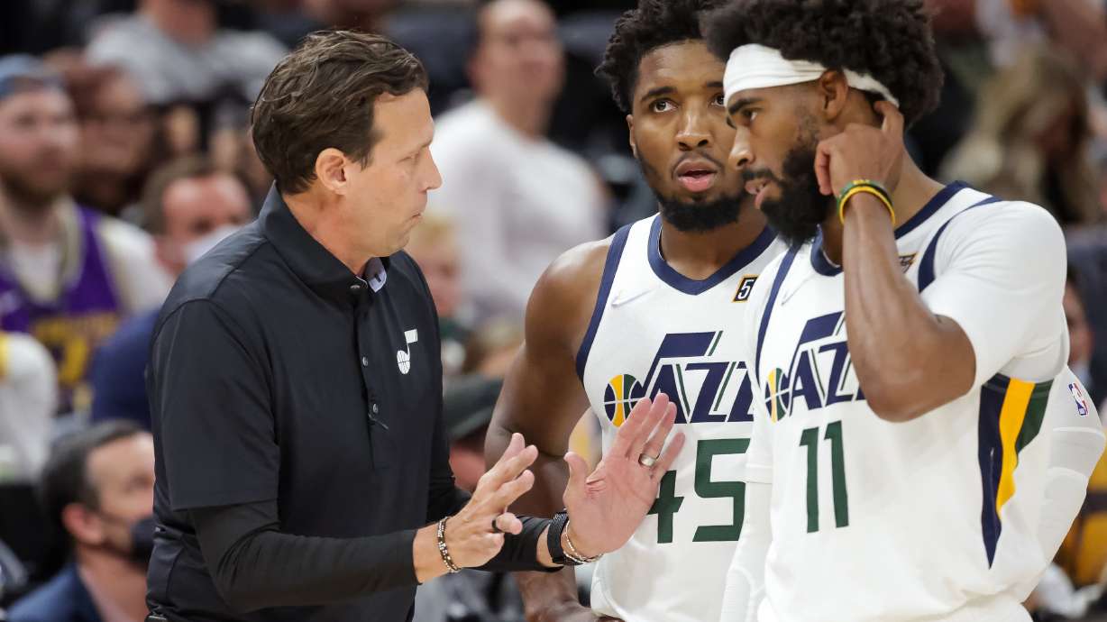 Utah Jazz head coach Quin Snyder talks to guard Donovan Mitchell (45) and guard Mike Conley (11) during the game against the Denver Nuggets at Vivint Arena in Salt Lake City on Tuesday, Oct. 26, 2021.