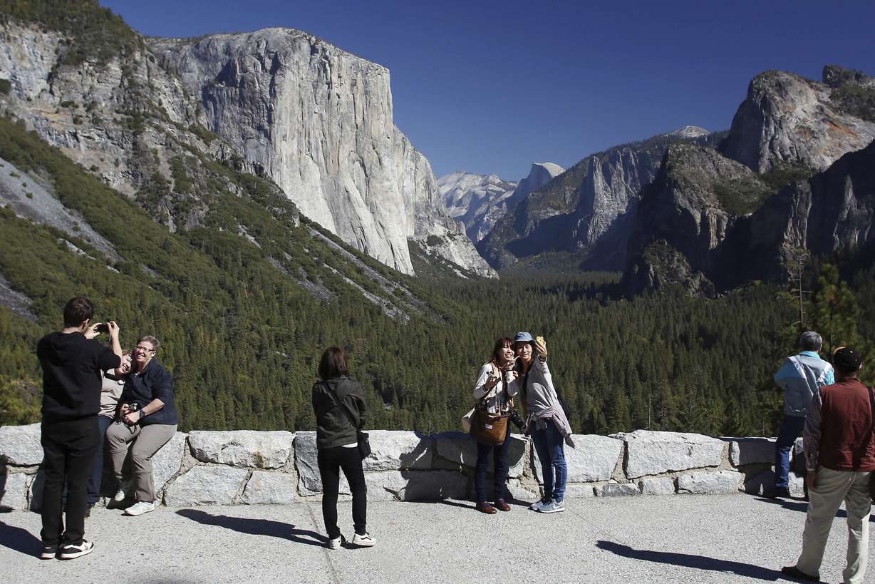 Visitors at Tunnel View enjoy the views of Yosemite National Park, Calif., on Oct. 17, 2013. The U.S. Senate has unanimously approved the nomination of Charles "Chuck" Sams III as National Park Service director, which will make him the first Native American to lead the agency that oversees more than 131,000 square miles of parks and other landmarks.