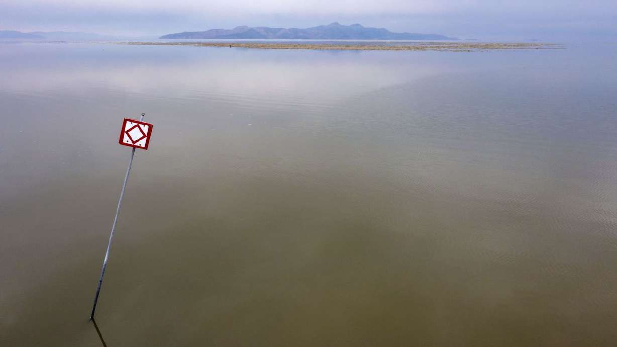 A warning sign is posted in the Great Salt Lake on
Friday. Sponsored by Rep. Blake Moore, R-Utah, the
Saline Lake Ecosystems in the bipartisan Great Basin States Program
Act passed the House Committee on Natural Resources with unanimous
support.