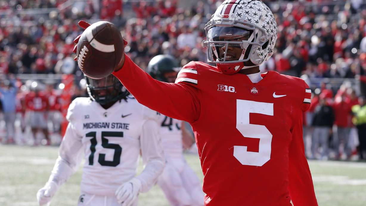 Ohio State receiver Garrett Wilson celebrates his touchdown against Michigan State during the first half of an NCAA college football game Saturday, Nov. 20, 2021, in Columbus, Ohio.