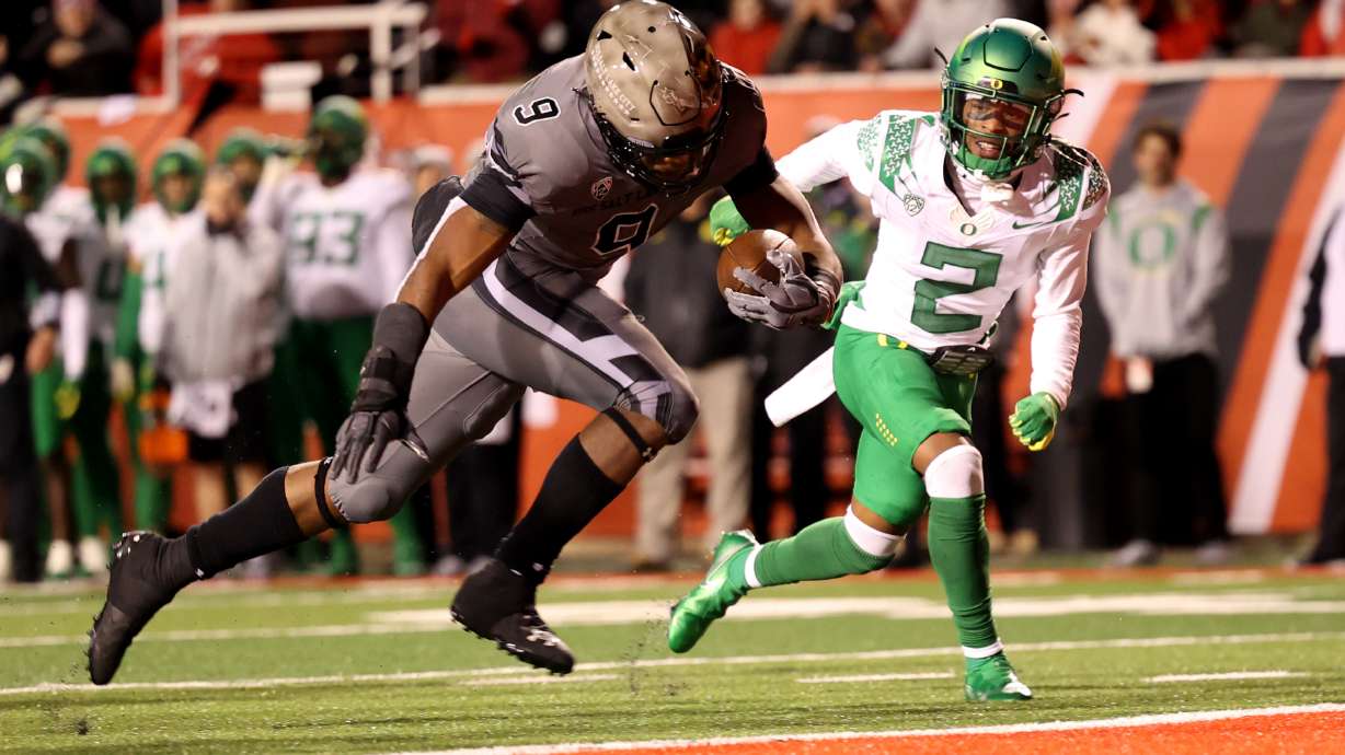 Utah Utes running back Tavion Thomas (9) scores a touchdown as Utah and Oregon play an NCAA football game at Rice Eccles Stadium in Salt Lake City on Saturday, Nov. 20, 2021.