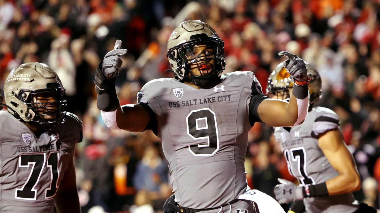 Utah Utes running back Tavion Thomas (9) celebrates after scoring a touchdown as Utah and Oregon play an NCAA football game at Rice-Eccles Stadium in Salt Lake City on Saturday, Nov. 20, 2021.