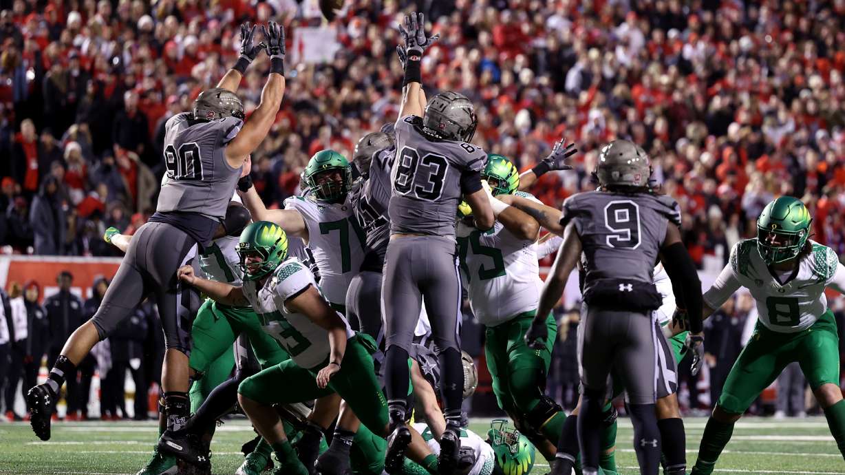 The Utah defends a field goal attempt that sailed wide as Utah and Oregon play an NCAA football game at Rice-Eccles Stadium in Salt Lake City on Saturday, Nov. 20, 2021.