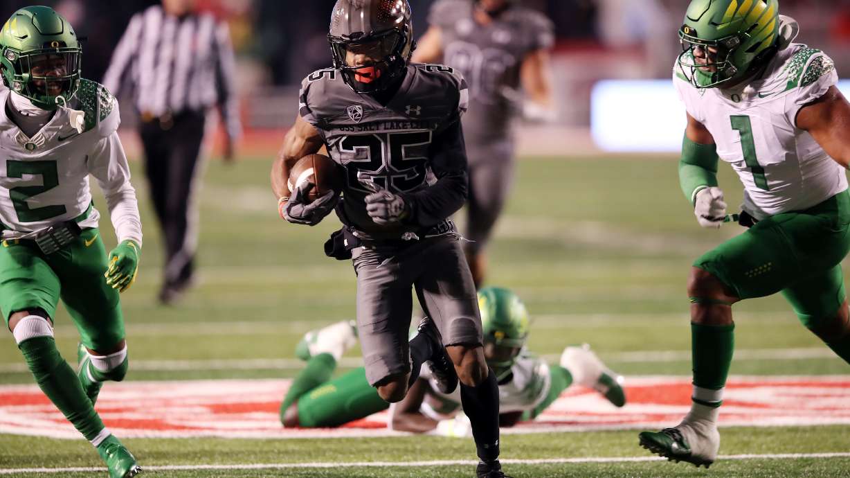 Utah Utes wide receiver Jaylen Dixon (25) breaks away for a run as Utah and Oregon play an NCAA football game at Rice-Eccles Stadium in Salt Lake City on Saturday, Nov. 20, 2021.