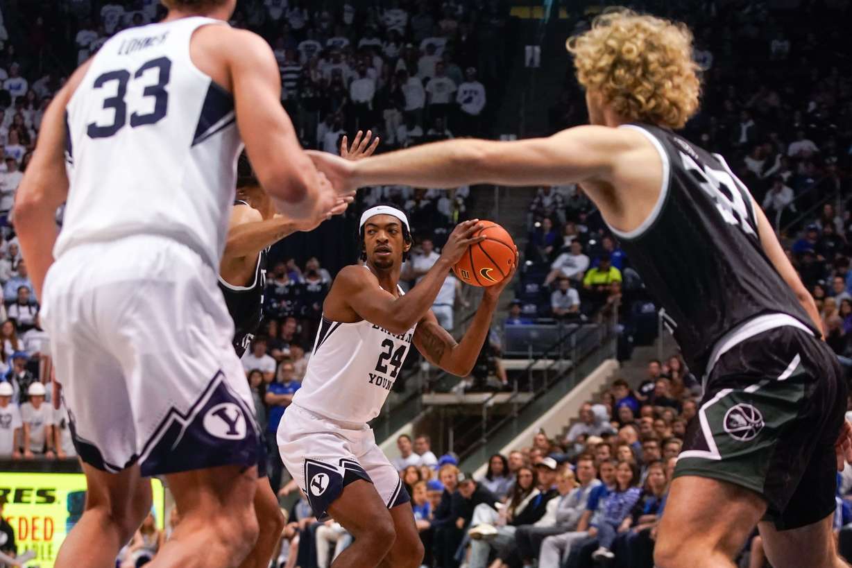 BYU forward Seneca Knight (24) looks to pass the ball against Central Methodist during an NCAA game at the Marriott Center in Provo on Saturday, Nov. 20, 2021.