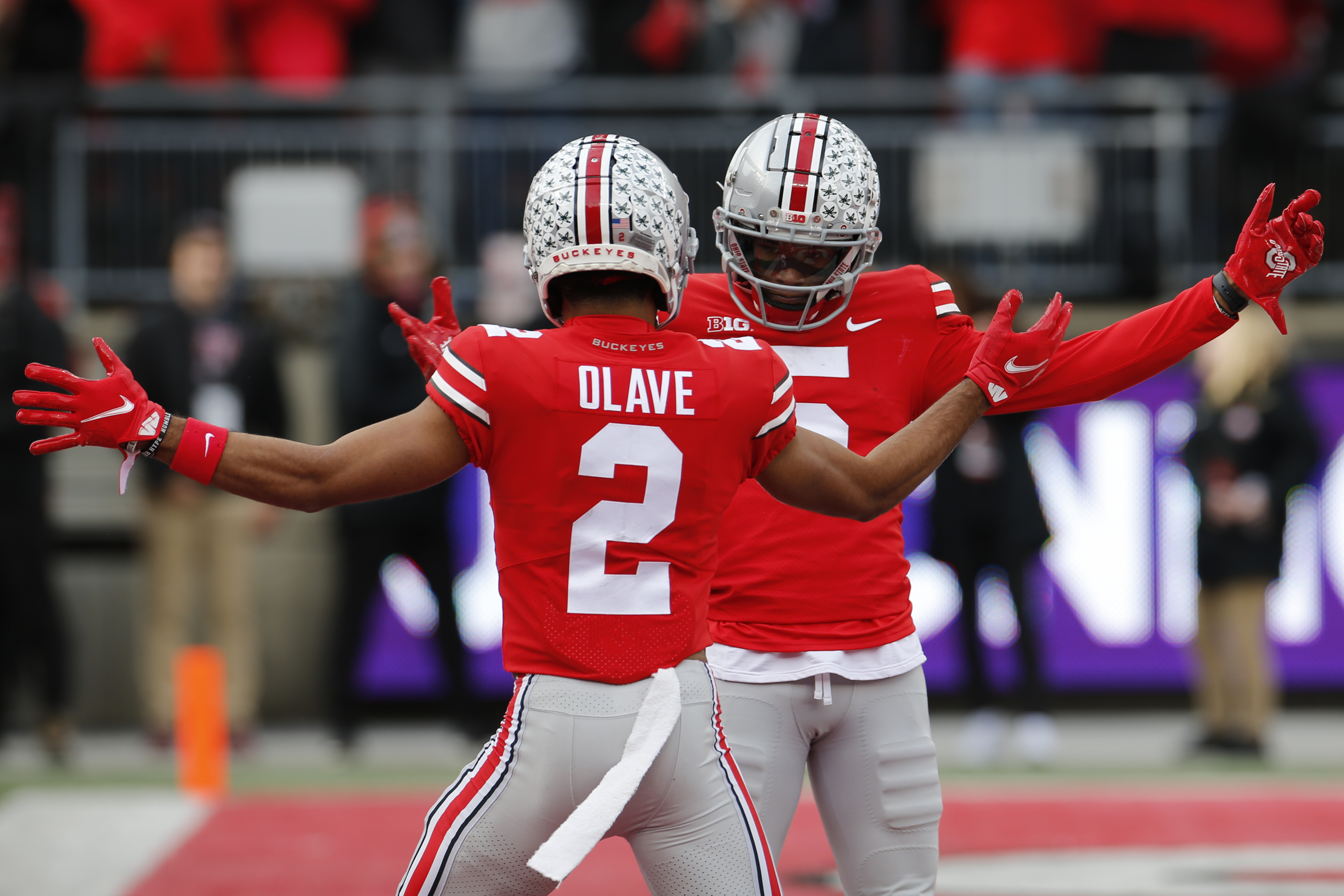 Ohio State receiver Garrett Wilson, right, celebrates his touchdown against Michigan State with teammate Chris Olave during the first half of an NCAA college football game Saturday, Nov. 20, in Columbus, Ohio.