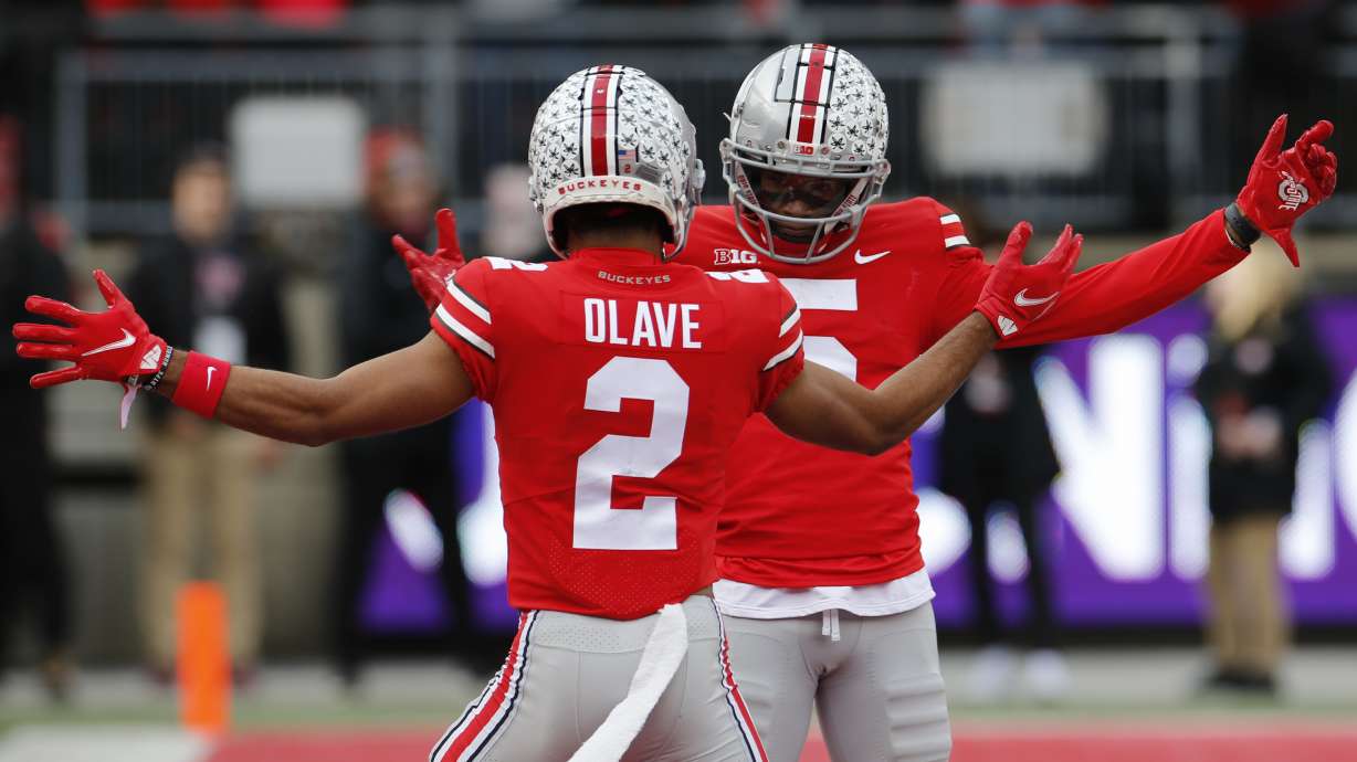 Ohio State receiver Garrett Wilson, right, celebrates his touchdown against Michigan State with teammate Chris Olave during the first half Nov. 20 in Columbus, Ohio.