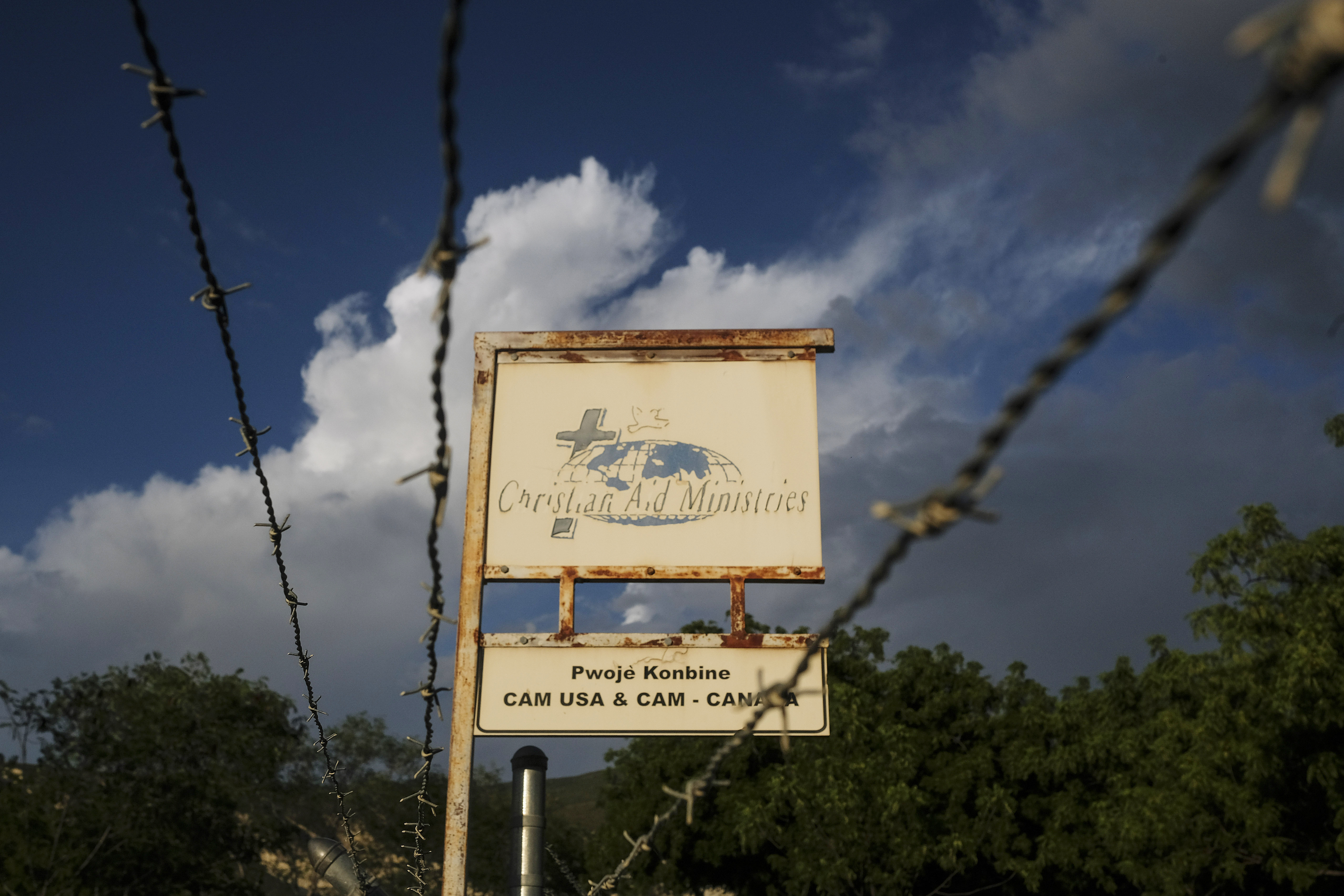 This Oct. 21, photo shows a sign outside Christian Aid Ministries in Titanyen, Haiti, which had 17 of their members kidnapped by the 400 Mawozo gang. Two of 17 abducted members of a missionary group have been freed in Haiti and are safe, “in good spirits and being cared for,” their Ohio-based church organization, Christian Aid Ministries, announced Sunday. 