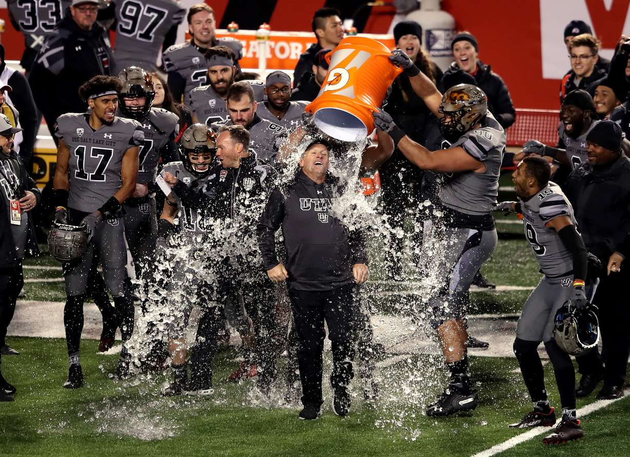 Utah Utes head coach Kyle Whittingham gets doused with water from a cooler as Utah defeats Oregon 38-7 in an NCAA football game at Rice-Eccles Stadium in Salt Lake City on Saturday. Whittingham became Utah's winningest coach with the win.