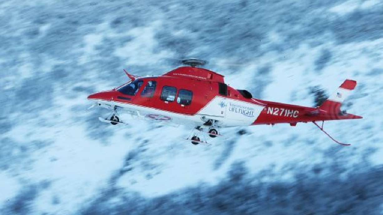 Davis County Search and Rescue crews and Life Flight work to rescue stranded snowmobilers in Bountiful on Tuesday, Jan. 19, 2016. The snowmobilers were flown out of Morgan County by Life Flight.