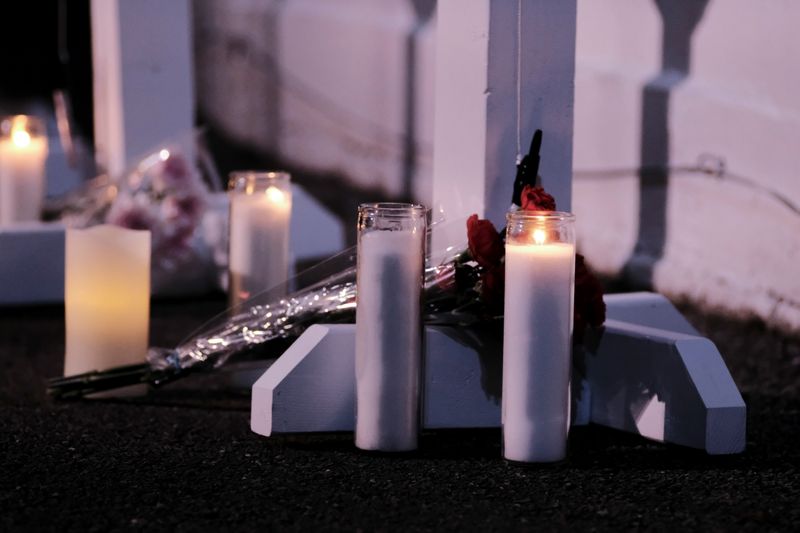 Kenosha residents attend a candlelight vigil Monday in remembrance of the victims a day after a car plowed through a holiday parade in Waukesha, Wisconsin, on Sunday.