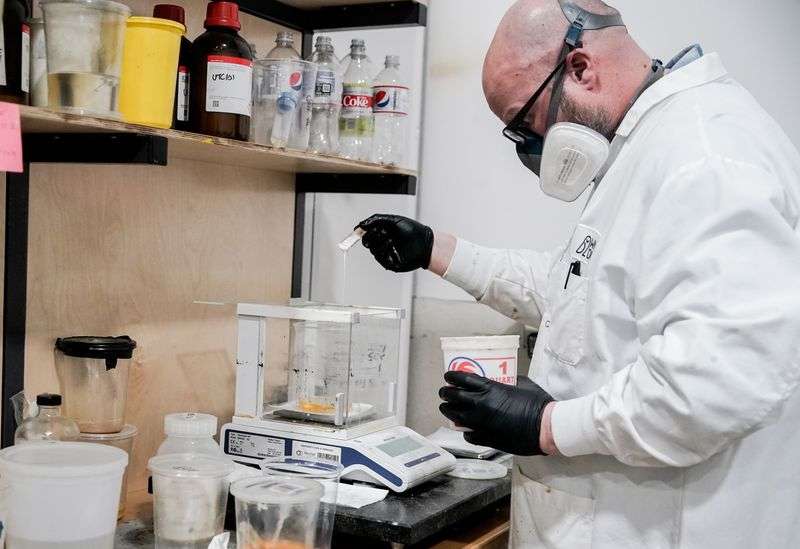 CJ Rand, of WNDR Alpine, mixes and weighs the chemical
precursor to the company’s algae oil-derived ski sidewalls at the
company’s facility in Salt Lake City on Friday.