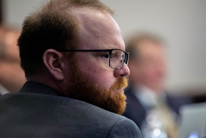 Travis McMichael sits with his attorneys before the start of closing arguments to the jury during his trial and of his father Gregory McMichael and William "Roddie" Bryan, charged with the February 2020 death of 25-year-old Ahmaud Arbery, at the Glynn County Courthouse, in Brunswick, Georgia. The case went to the jury Tuesday morning.
