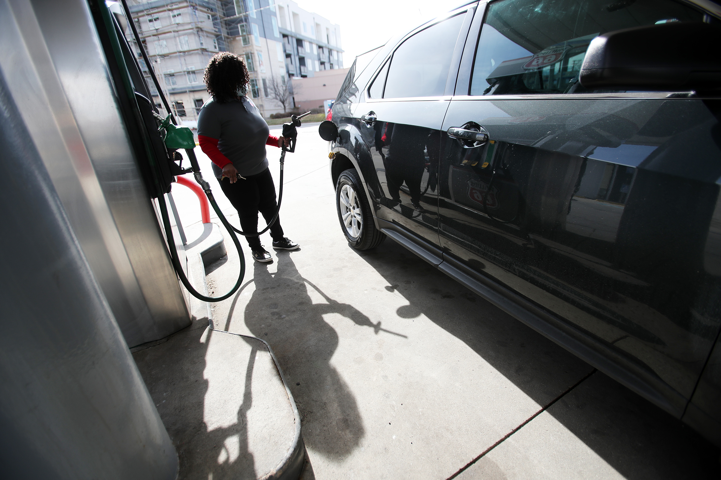 Rosiland Edwards prepares to pump gasoline at Harts Gas & Food in Midvale on March 24. Utah's average gas prices are up 60% from the same time last year, according to AAA.
