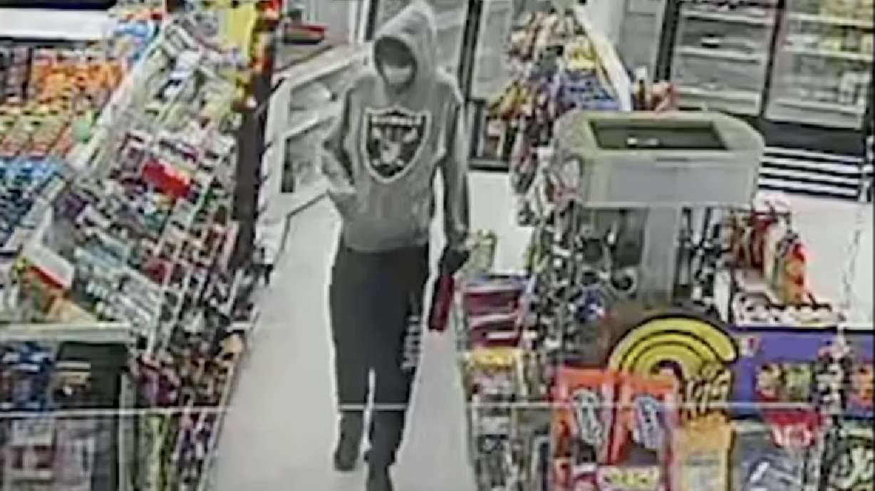 Antonio Gianny Garcia is seen in security footage before shooting and killing an Ogden grocery store owner in February 2021. Taydon Tailor Law, 22, was convicted of selling Garcia the stolen gun used in the murder. 