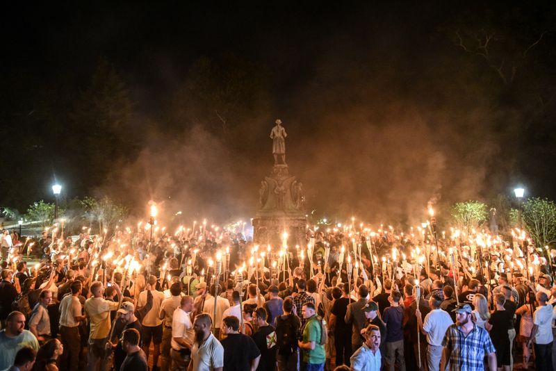 White nationalists participate in a torch-lit march on the grounds of the University of Virginia ahead of the Unite the Right Rally in Charlottesville, Va., on Aug. 11, 2017.