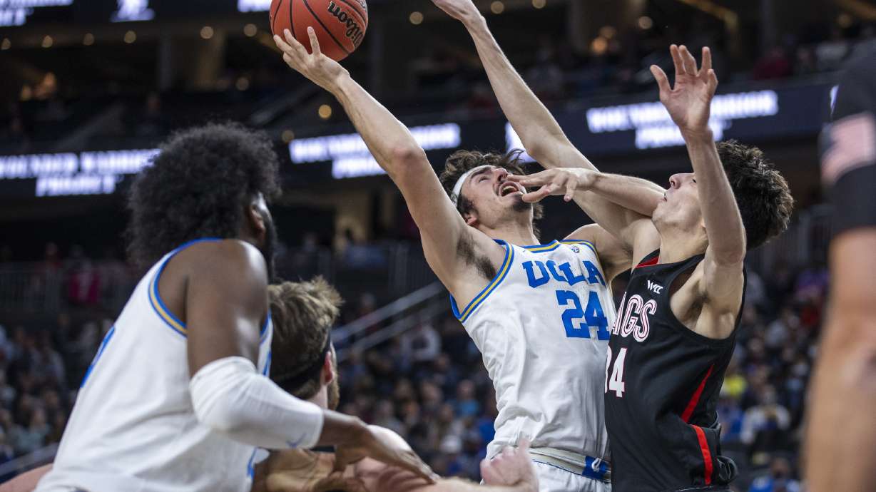 UCLA guard Jaime Jaquez Jr. (24) has a drive rejected by Gonzaga center Chet Holmgren (34) during the first half of an NCAA college basketball game Tuesday, Nov. 23, 2021, in Las Vegas.
