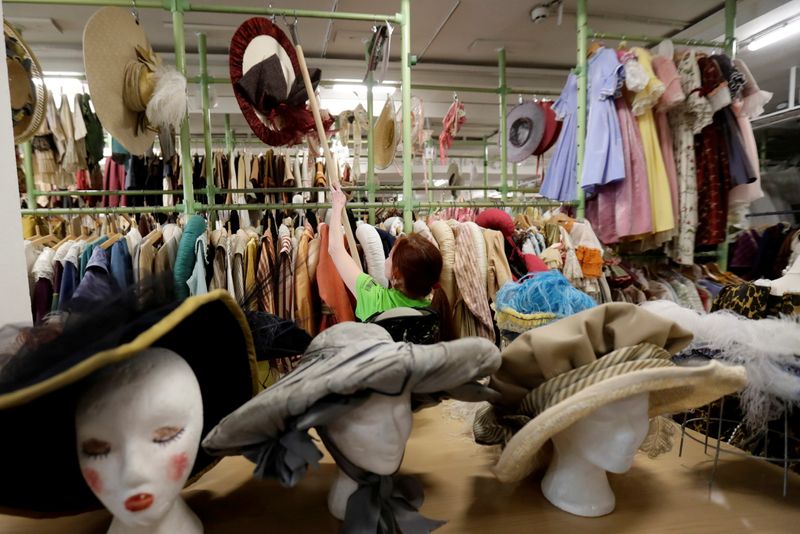 An employee works in a costume and props storage of the Barrandov Studio in Prague, Czech Republic, April 8, 2019.