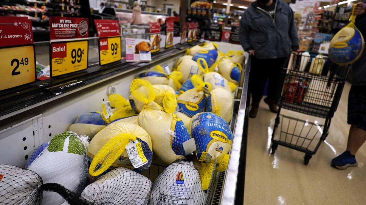 People shop for frozen turkeys for Thanksgiving dinner at a grocery store in Mount Prospect, Ill., on Nov. 17.